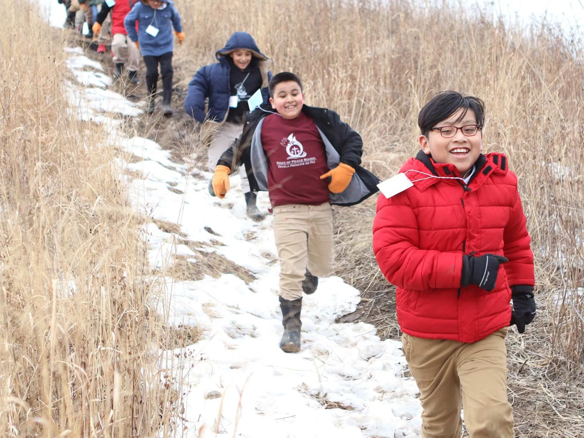 Urban Ecology Center children on trail in winter