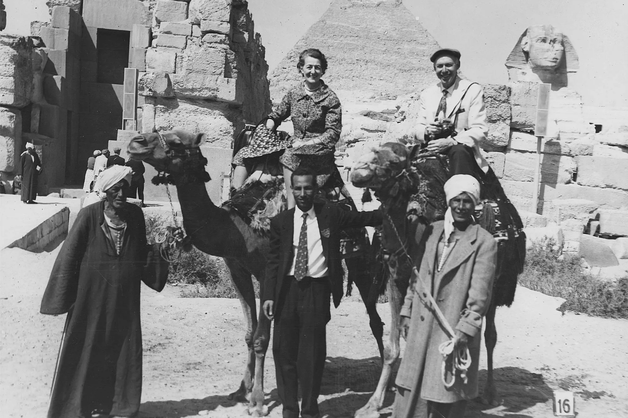 Ethel and Richard Herzfeld on camels near pyramids and the Great Sphinx